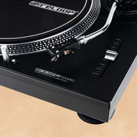 Close up view of Reloop RP-1000 MK2 Belt-Drive Turntable System on orange background