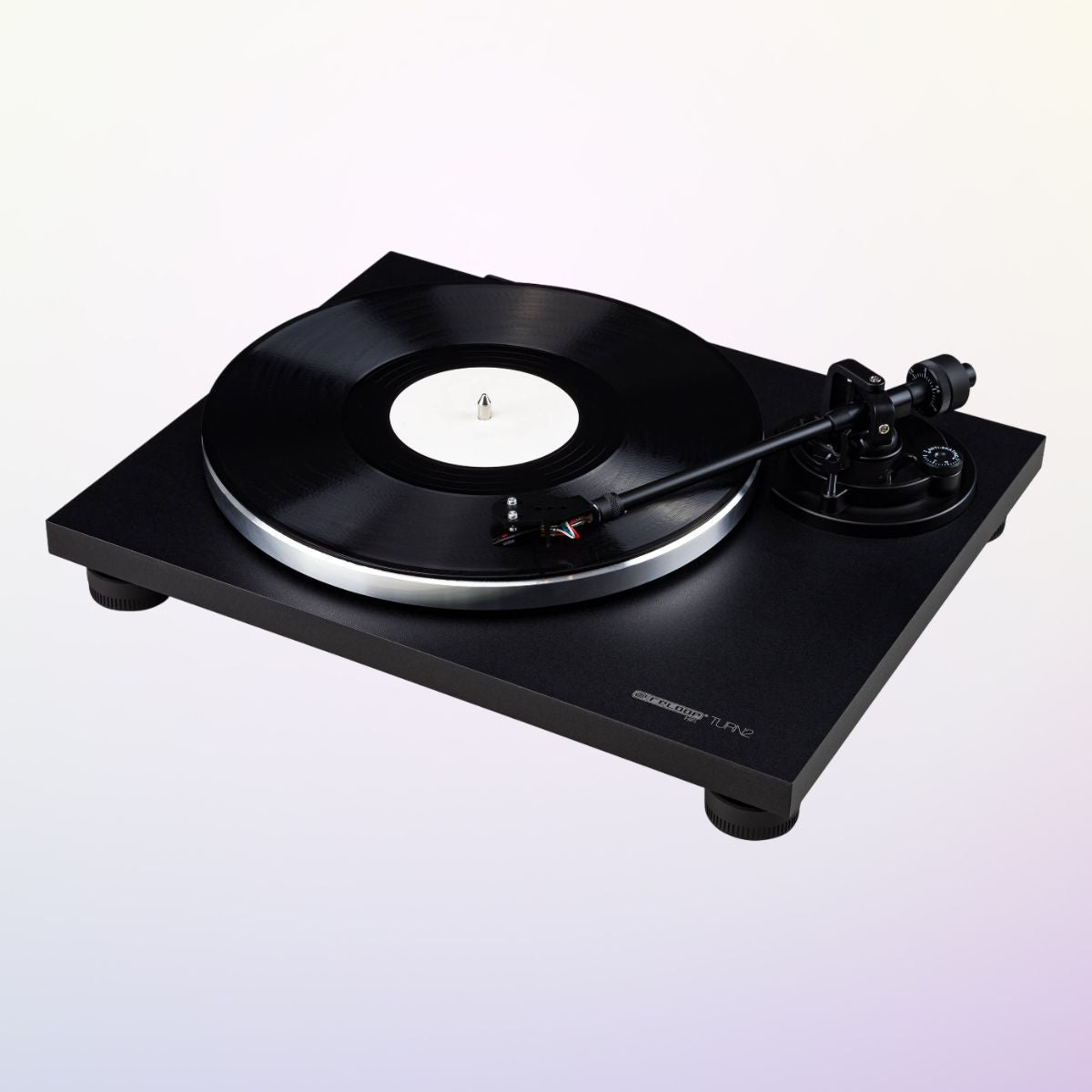 Angled view of Reloop TURN2 Belt-Driven Hi-Fi Turntable on purple gradient background