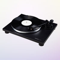 Angled view of Reloop TURN2 Belt-Driven Hi-Fi Turntable on purple gradient background