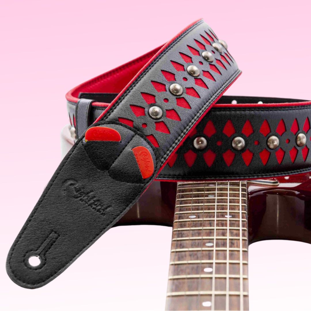 Curled view of RightOn Armour Red on top of electric guitar with pink background