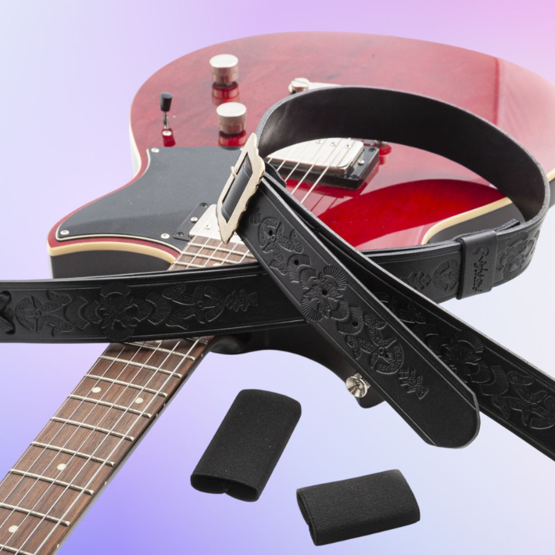 Close up view of RightOn Legend BM Bohemian Guitar Strap on top of red electric guitar with elastic slide holders on purple background