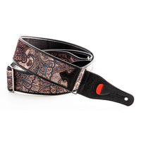 Curled view of RightOn Paisley Velvet Guitar Strap Brown on white background