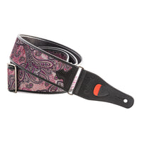 Curled view of RightOn Paisley Velvet Guitar Strap Burgundy on white background