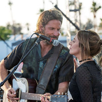 Bradley Cooper using the RightOn Smooth Leather Bass Strap Brown on guitar while singing with Lady Gaga