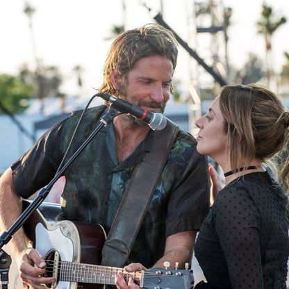 Bradley Cooper using the RightOn Smooth Leather Bass Strap Brown on guitar while singing with Lady Gaga