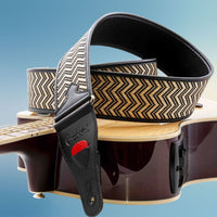 Close up view of RightOn Victoria Guitar Strap on top of acoustic guitar with blue background