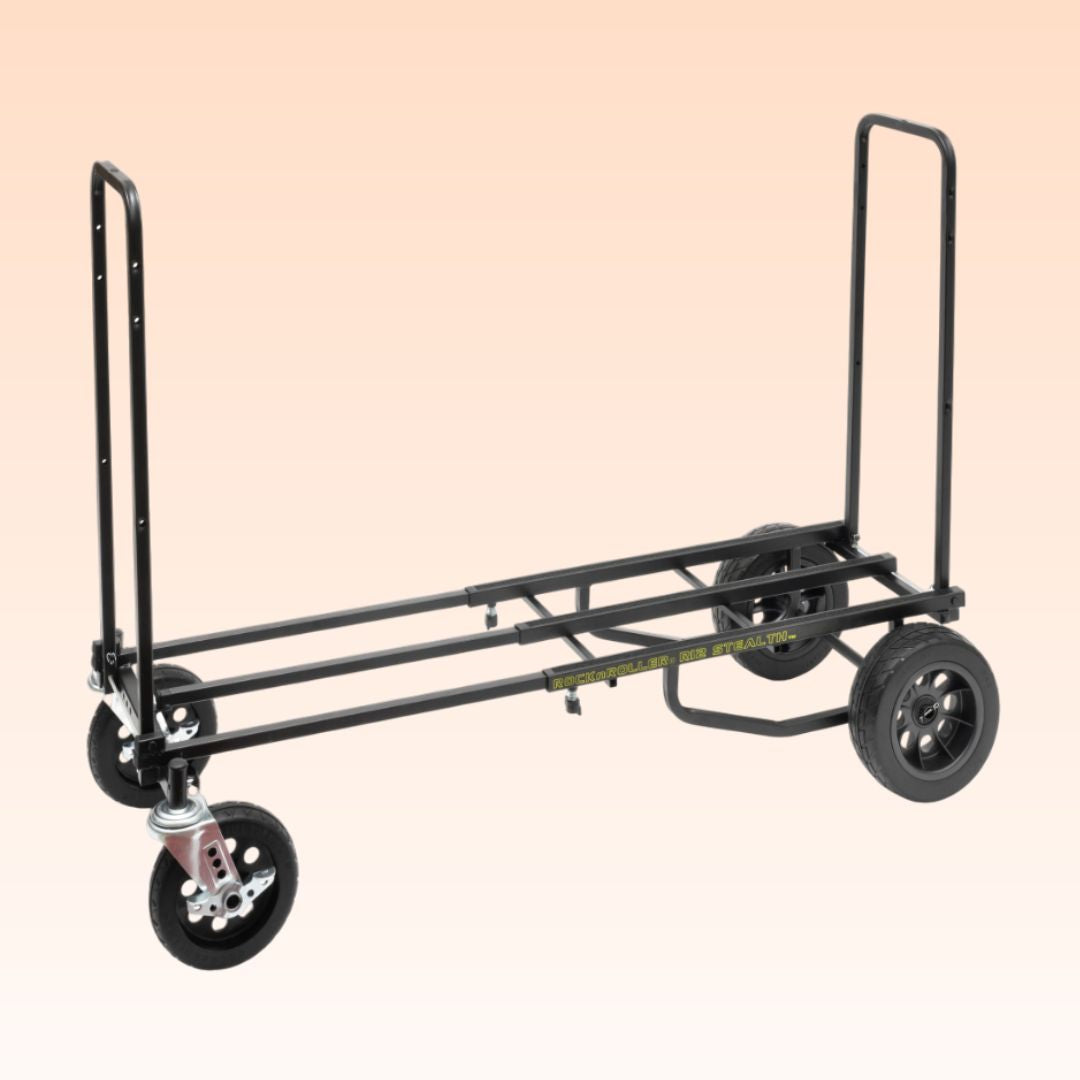 Black dolly with wheels on a beige background