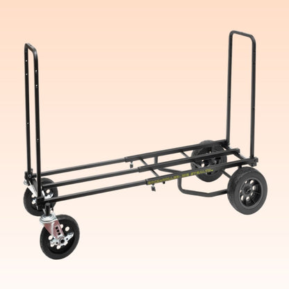 Black dolly with wheels on a beige background