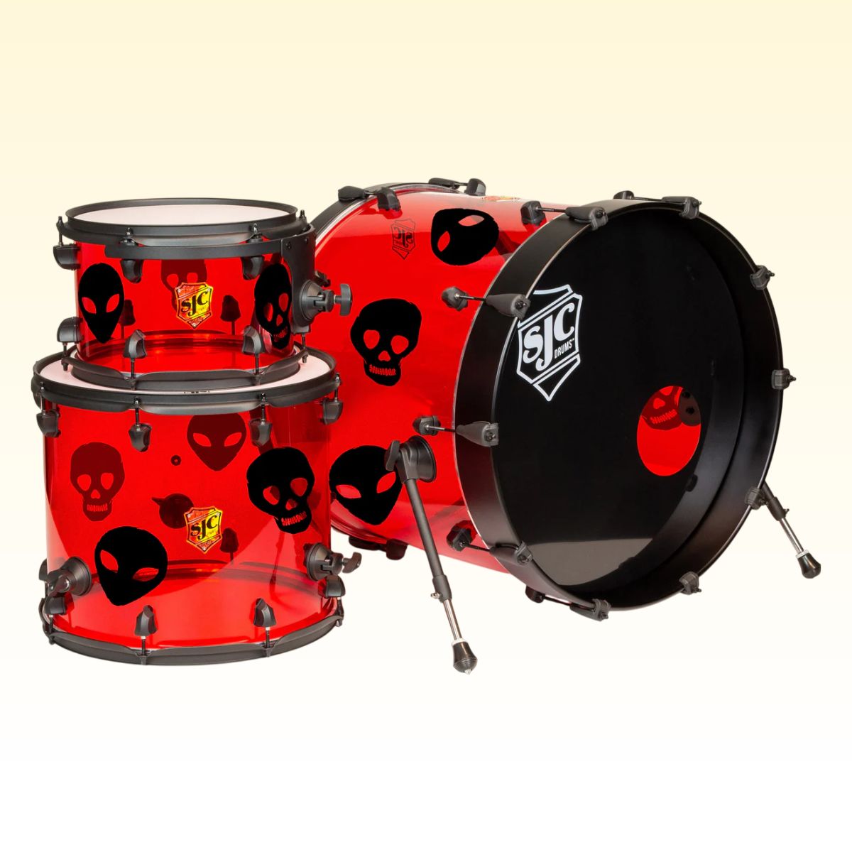 Inclusions of SJC Drums Josh Dun Torch 3-Piece Kit Red with decals attached on yellow background