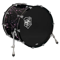 Angled view of SJC Drums Navigator 18" x 22" Bass Drum Black with Pink Splatter on white background