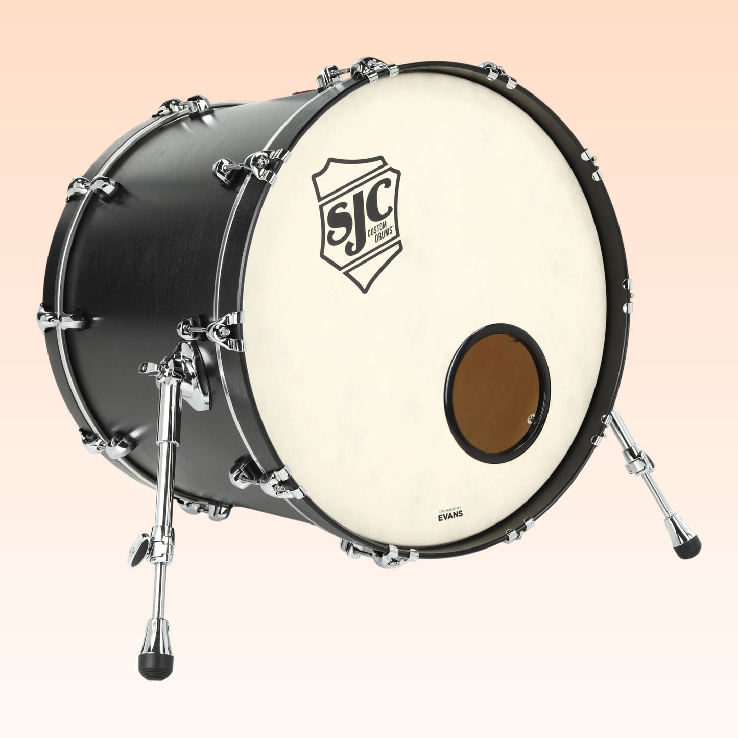 Angled front view of SJC Drums Tour 18" x 22" Bass Drum Matte Black on orange background