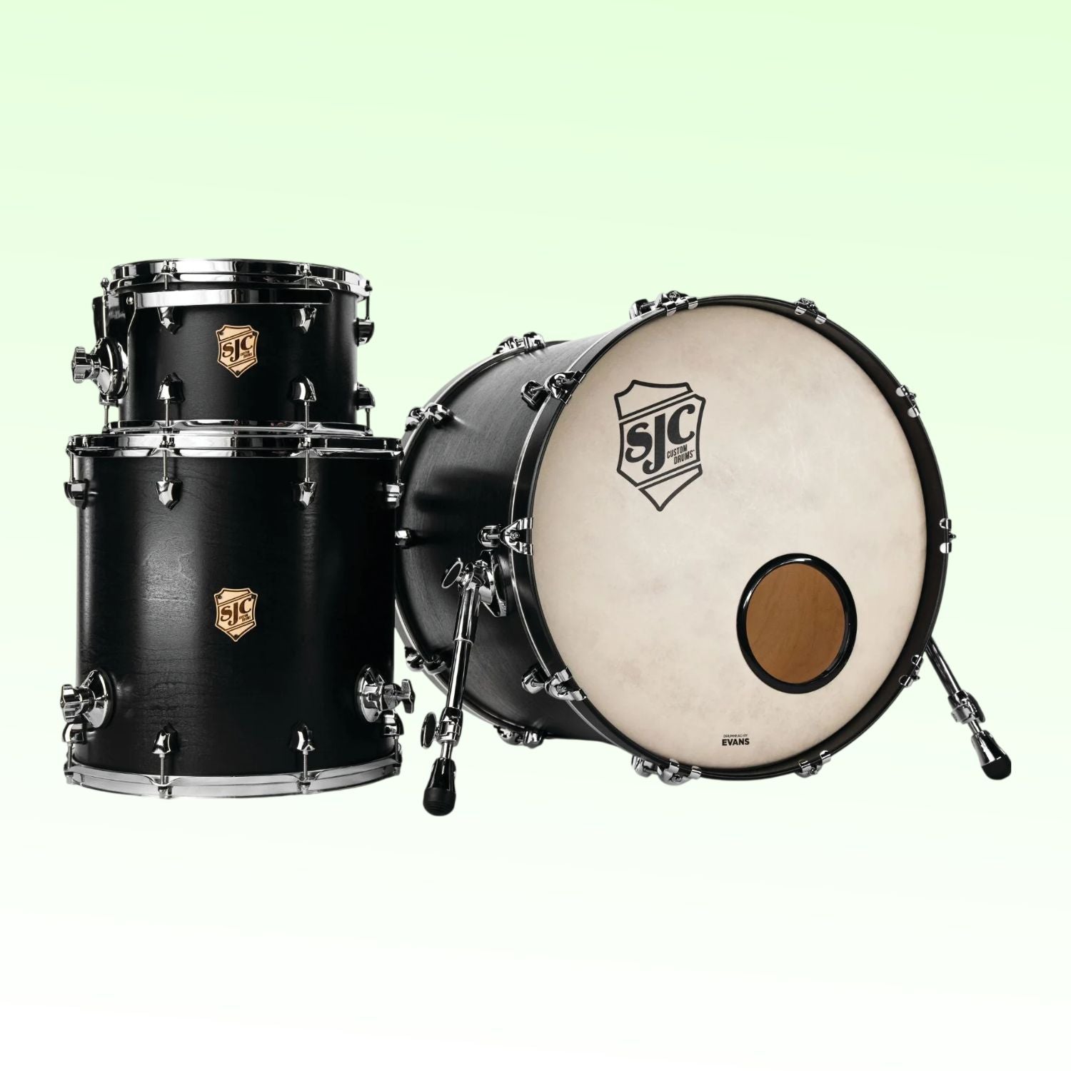 Inclusions of SJC Drums Tour Series 3-Piece Kit Matte Black on green background