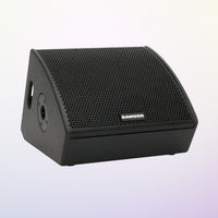 Black Samson speaker on a light purple background