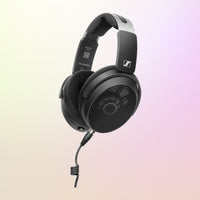 Angled view of Sennheiser HD 490 PRO Plus Headphones on pink and yellow gradient background