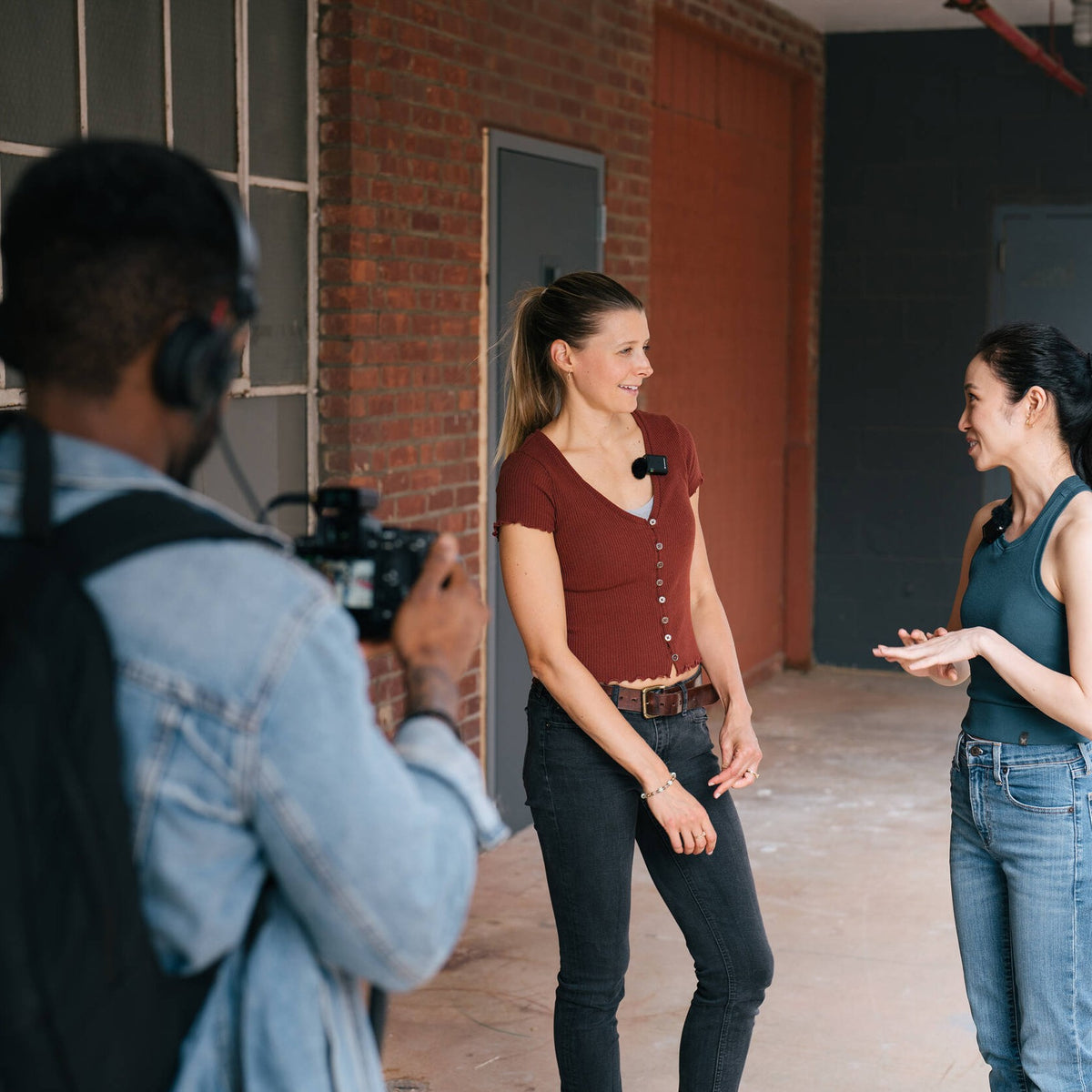 Group of people using the Sennheiser Profile Wireless 2-Channel Set to shoot content outdoors