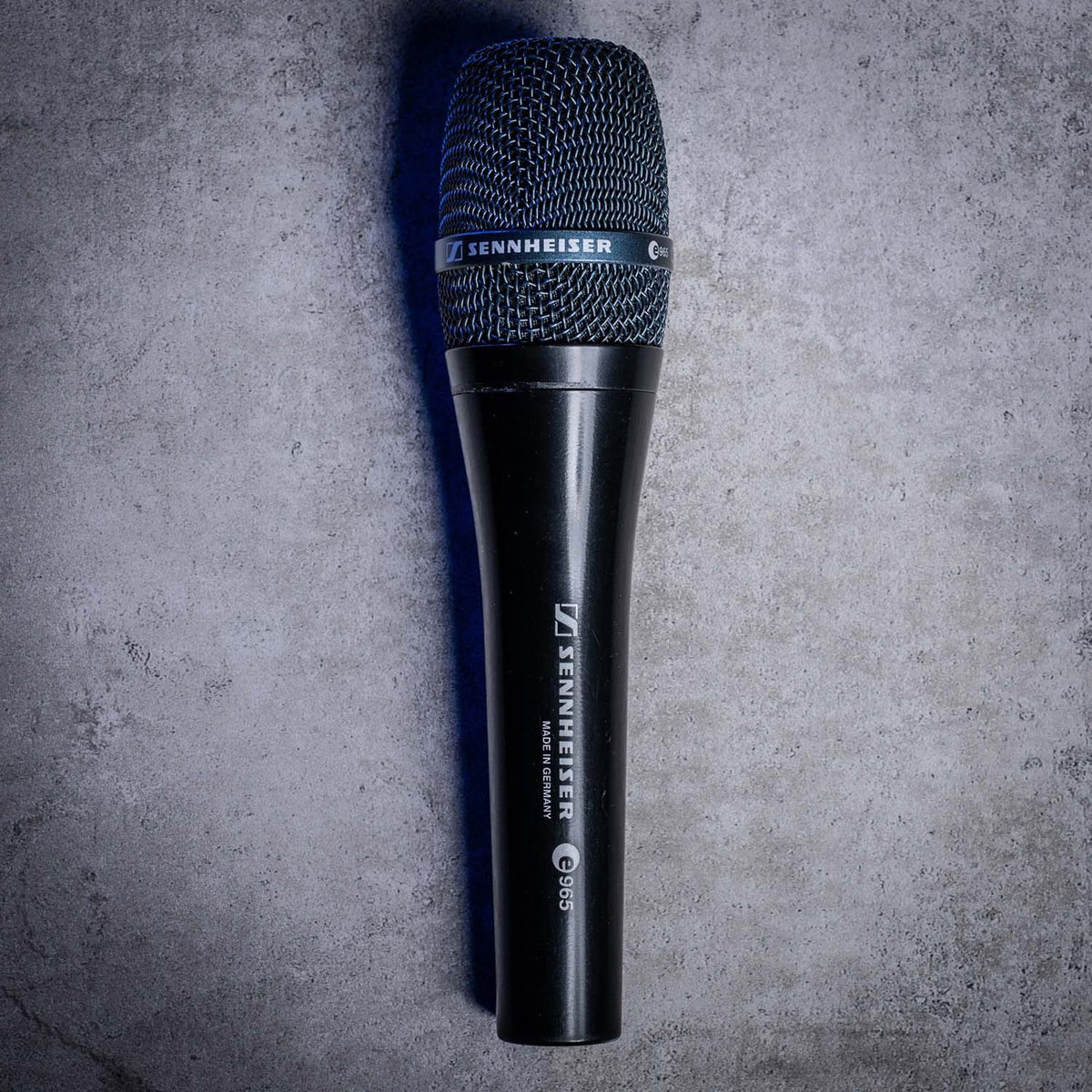 Front view of Sennheiser e 965 Handheld Condenser Microphone on concrete surface
