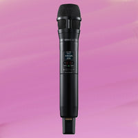 Front view of Shure Nexadyne 8 Microphone Capsule for Wireless Transmitters Cardioid Black mounted on SLXD2 on pink background