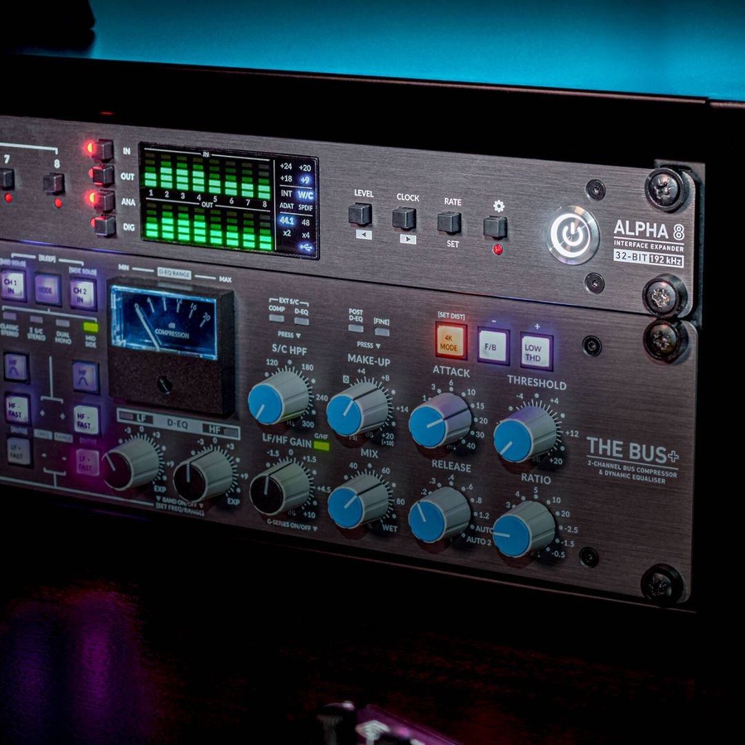 Angled close up view of Solid State Logic ALPHA 8 AD/DA Converter and USB Audio Interface on top of rackmount effect in studio rack