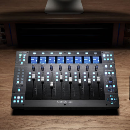 Front view of Solid State Logic UF8 Advanced DAW Controller on wooden desk