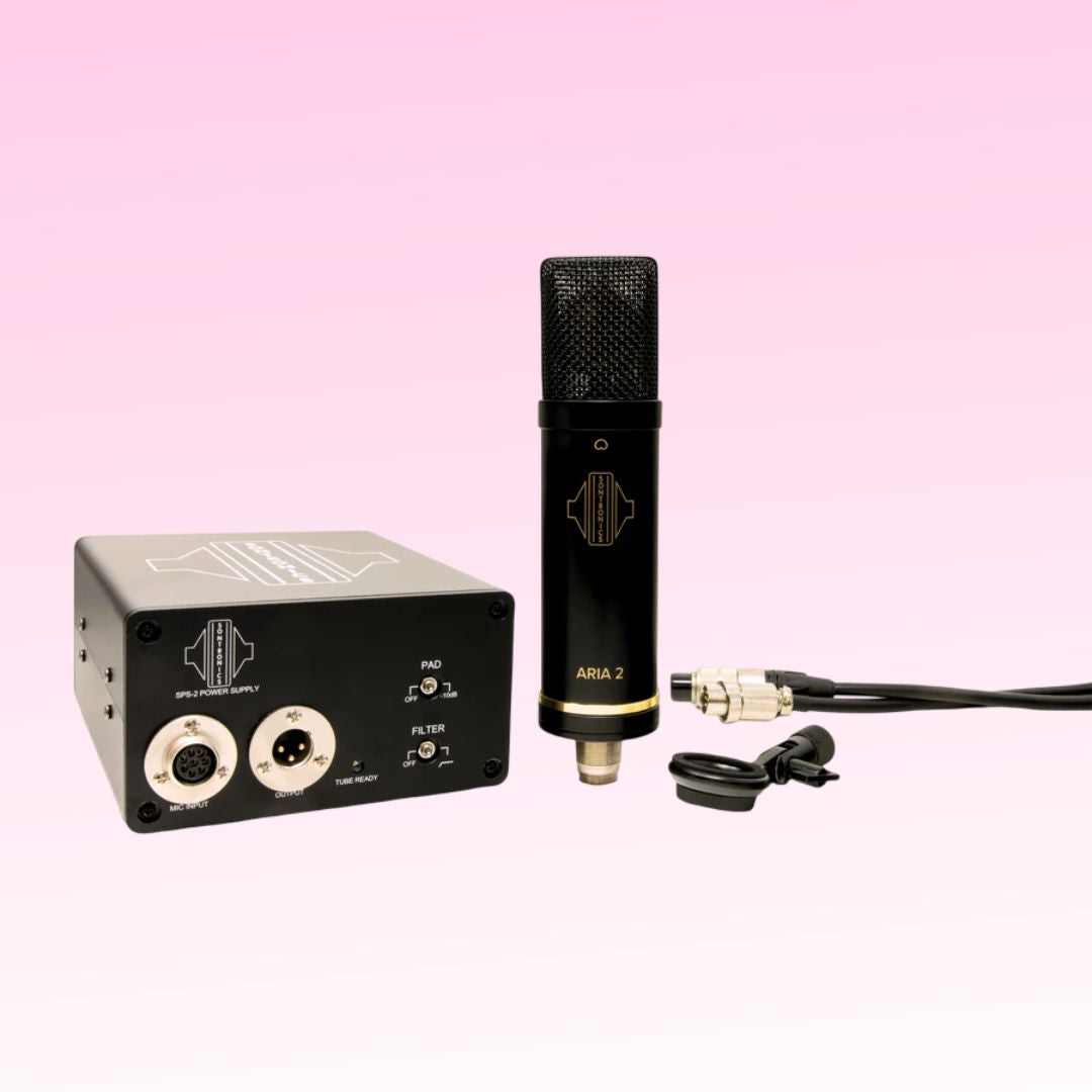 Front view of Sontronics ARIA 2 Tube Condenser Microphone, power supply, cable, and other inclusions on pink background