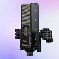 Angled view of Sontronics SIGMA 2 Phantom-Powered Ribbon Microphone on shockmount on purple background