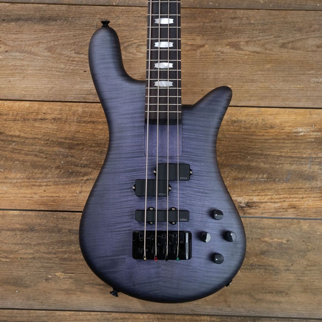 Close up front view of Spector Euro 4 LX Bolt-On Bass Guitar Nightshade on wooden background