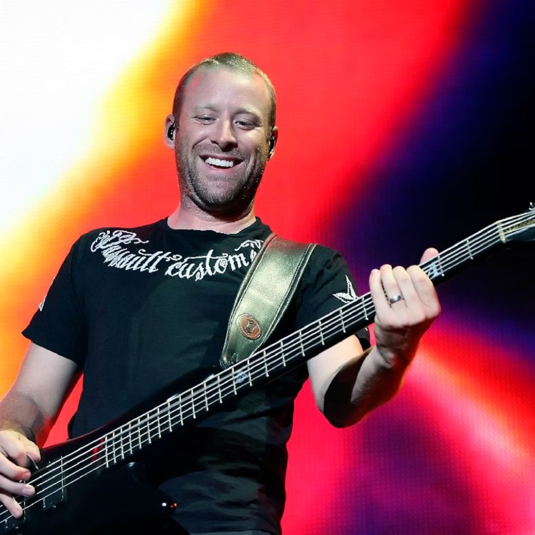 Mike Kroeger playing Spector MK-5 Pro Mike Kroeger Signature Bass Guitar on stage with colorful backdrop