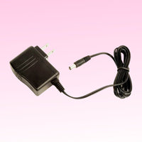 Side view of Strymon 9V Power Supply on pink background