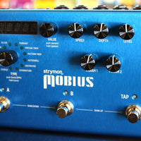 Close up view of Strymon Mobius with colorful background