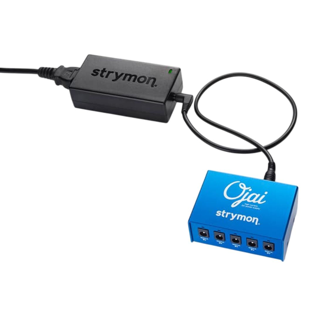 Top view of Strymon Ojai plugged into its power brick on white background