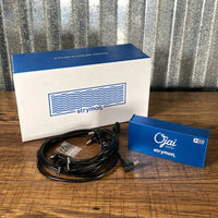 Front view of Strymon Ojai R30 Expansion Kit with box and cables on wooden surface with metal background