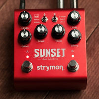 Front view of Strymon Sunset on wooden surface