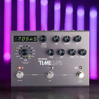 Top view of Strymon TimeLine Multi Delay Pedal on reflective desk with purple and violet background