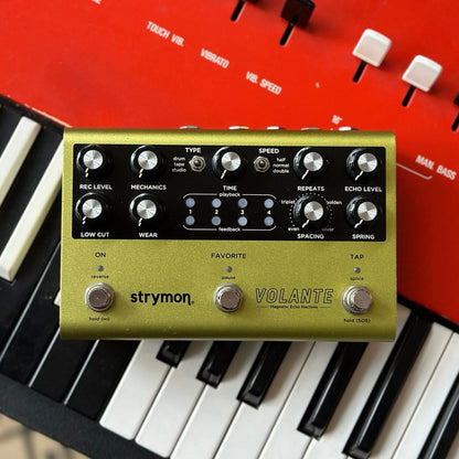 Front view of Strymon Volante on top of red keyboard