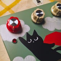 Close up view of TONECAT SkyClaw Overdrive Pedal Standard on beige cloth with yellow stripes