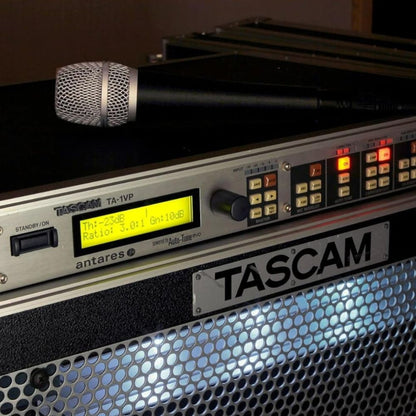 Close up angled front view of Tascam TA-1VP Antares Auto-Tune Vocal Processor & Mic Preamp with mic on top in studio