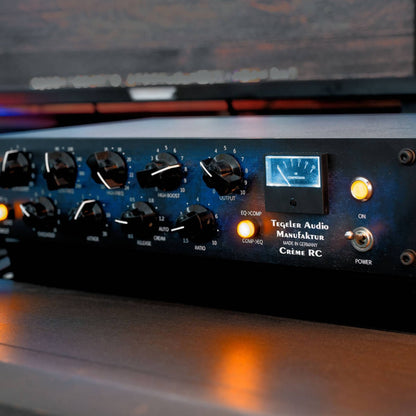 Angled close up view of Tegeler Creme RC Bus Compressor and Mastering Equalizer on desk in studio