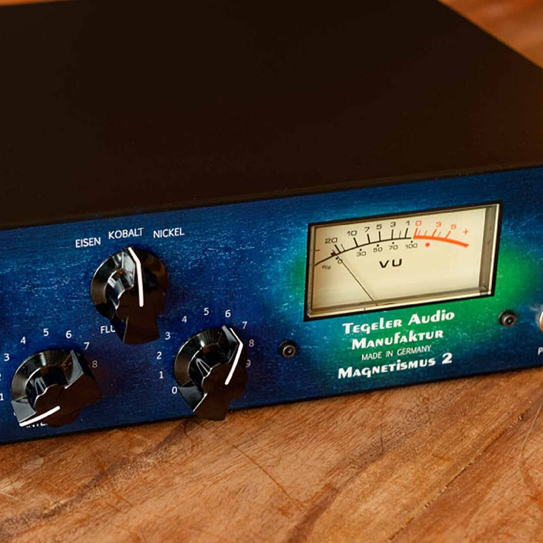 Close up angled front view of Tegeler Magnetismus 2 Transient Shaper & VCA Compressor on wooden surface
