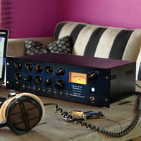 Angled front view of Tegeler Vari Tube Recording Channel Channel Strip on desk in room
