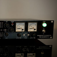 Close up shot of black rackmount effect on reflective table with white background