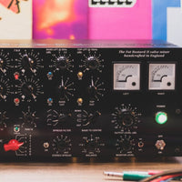 Close up of black rackmount effect on top of desk with colorful background