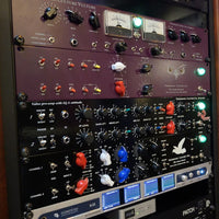 Assorted rackmount effects on rack in studio