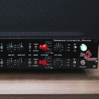 Close up of black rackmount effect on top of wooden table with black background