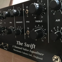 Close up of knobs of a rackmount effect on top of table