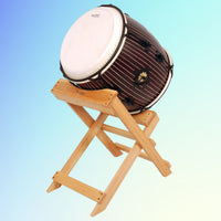 Angled view of Tycoon 16" Nagado Daiko Handcrafted Pinstripe on stand with blue background