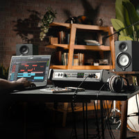 Universal Audio Volt 876 USB Recording Studio in rack on desk with engineer recording on a laptop through it inside studio