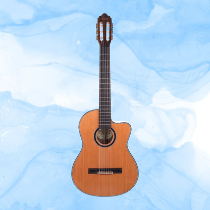 Front view of Valencia VC774TCE 700 Series Classical Electric Guitar on blue background