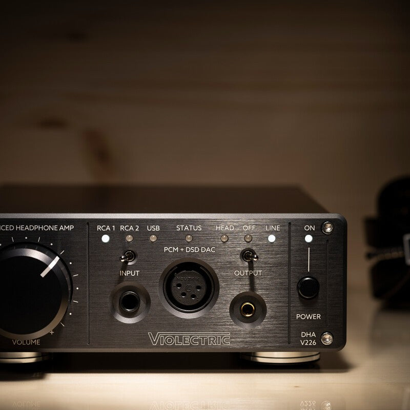 Close up view of Violectric DHA V226 Headphone Amplifier on wooden surface