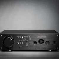 Front view of Violectric DHA V380² Headphone Amplifier on grey surface