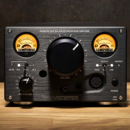Front view of Violectric HPA V324 Headphone Amplifier on wooden surface